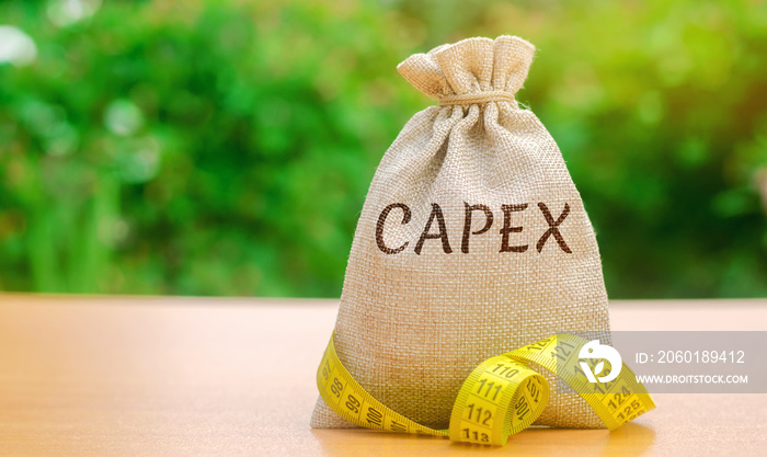 Money bag with the word Capex ( capital expenditure ) and tape measure. Capital used by companies to acquire or upgrade physical assets. Business management concept