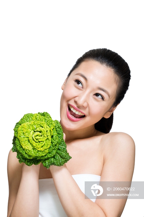 棚拍年轻女人和绿色蔬菜