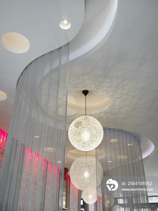 Ceiling lights and string curtains in nightclub