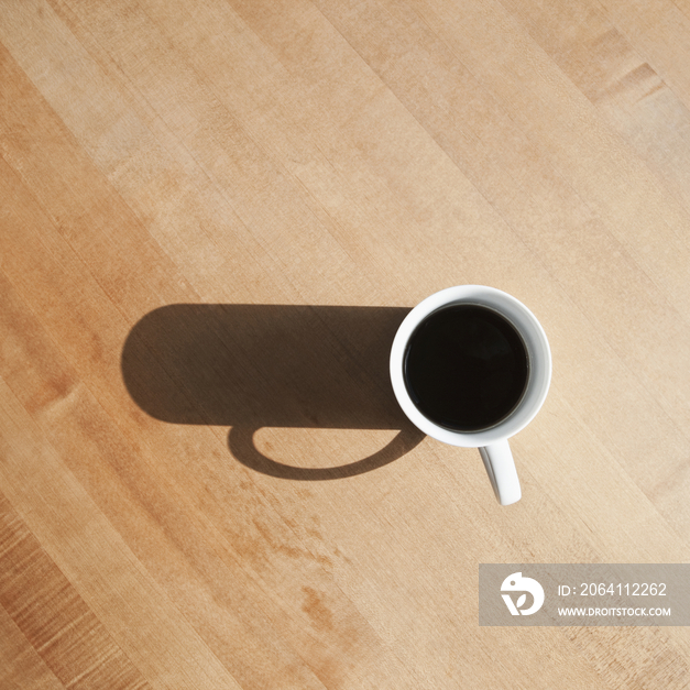 Coffee Cup and Shadow on a Table