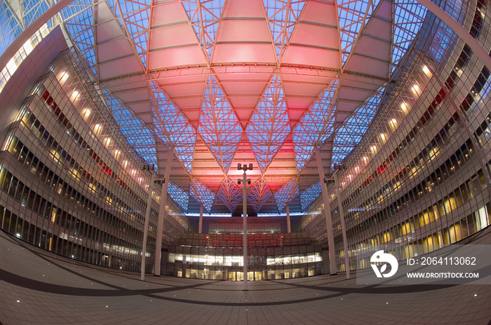 Birds eye view of walkway with columned ceiling in illuminated modern office building