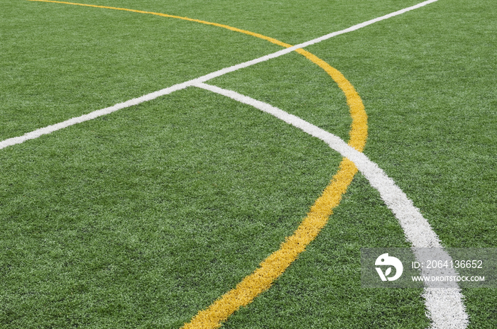 Lines painted on the astro turf sports ground of a modern secondary school