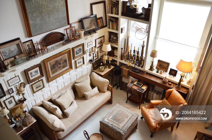 High angle view of sofa and armchair in middle class living room