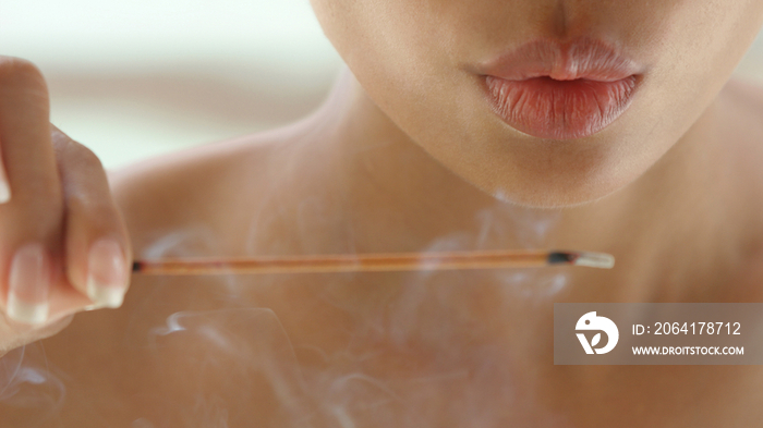 Woman with incense stick