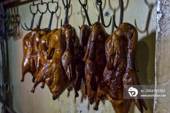 Peking Roast Ducks Hanging from a Pole, Beijing, China