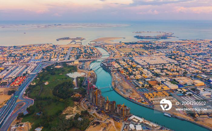 Aerial view of Tolerance bridge. Structure of architecture with lake or river, Dubai Downtown skylin