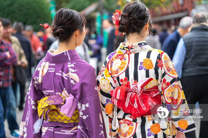 Young girl wearing Japanese kimono standing in front of Sensoji Temple in Tokyo, Japan. Kimono is a 