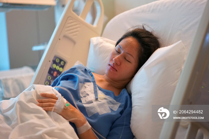 Asian Chinese Woman patient lying in the hospital bed calm and peaceful