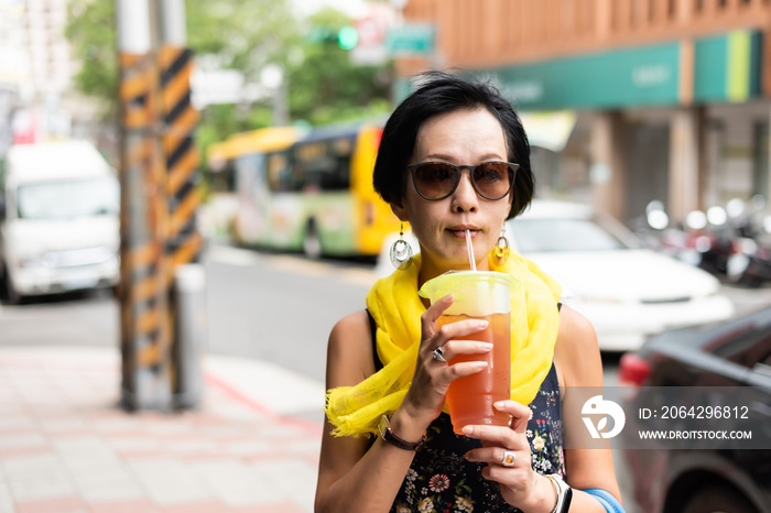 woman have a black tea at the street