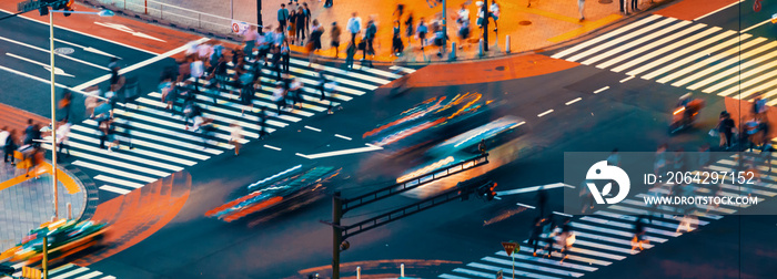 Traffic crosses a busy intersection in Shibuya, Tokyo, Japan