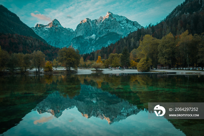 Beautiful lake jasna in kranjska gora with visible reflections of Razor and Skrlatica in the water i