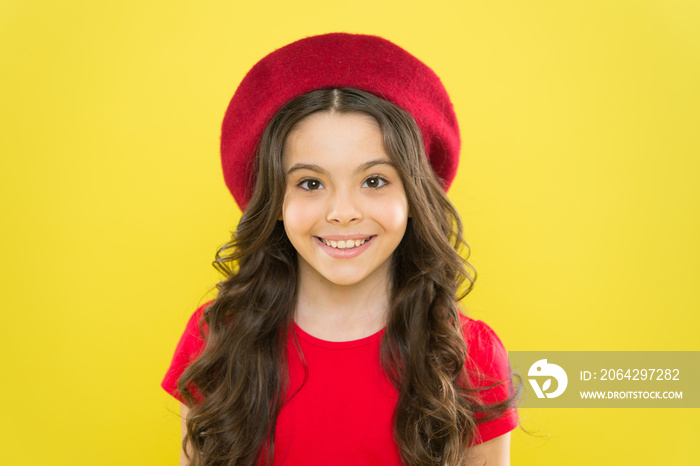 French style inspiration. Adorable small girl wearing red beret in fashion style. Little cute child 