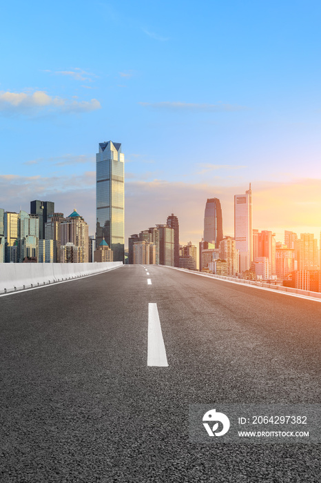 Asphalt highway passes through the city financial district in Chongqing at sunset,China.