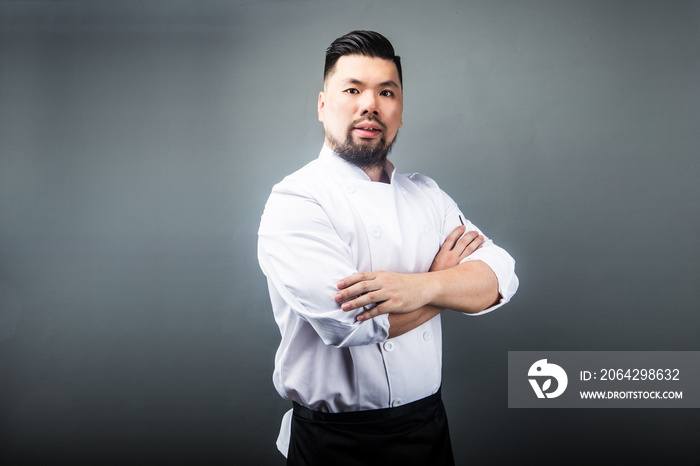 An Asian male chef，Gray background