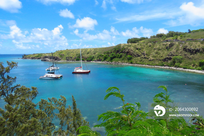 Amazing view over Honolua Bay where sail boats are moored and tourists snorkel to discover the colou
