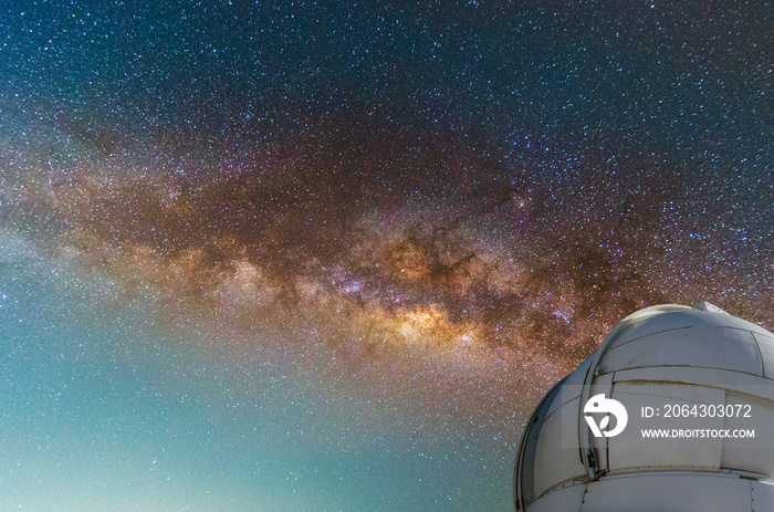 observatory with milky way galaxy, long exposure photograph, with grain.Image contain certain grain 