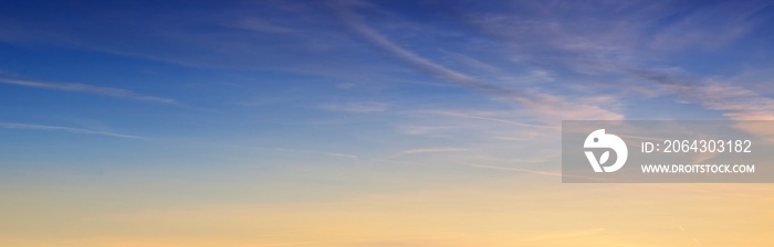 Clear sky at sunrise. Natural gradient of orange and blue colors. Golden sunlight. Abstract pattern,