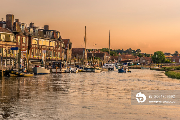 A view of the moorings on the River Glaven at sunset in Blakeney, Norfolk, UK