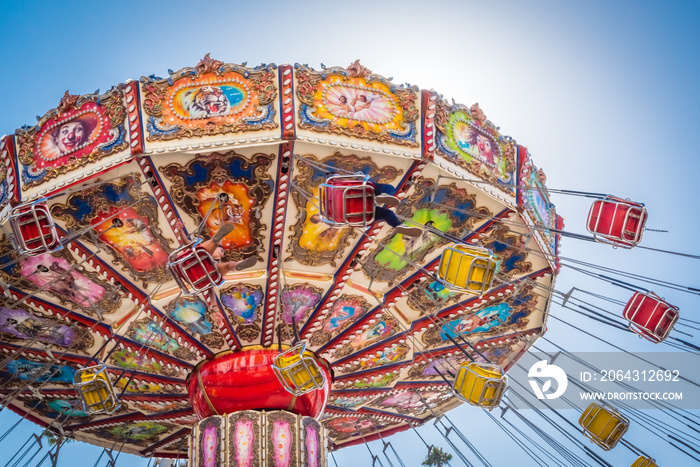 A colorful fair swinging ride.