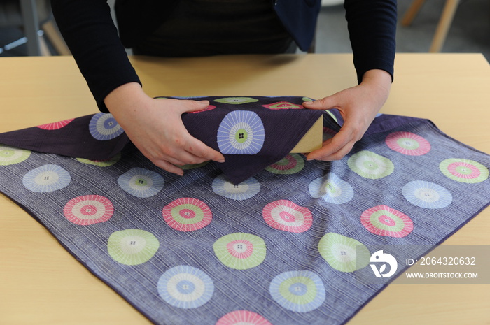 Furoshiki traditional Japanese ecological gift wrapping cloth and technique demonstration