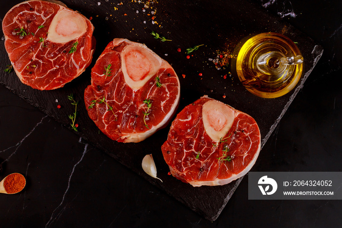 Three pieces of raw fresh beef shank bone in with spices.