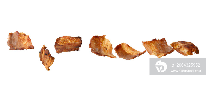 various small fried bacon pieces isolated on white background