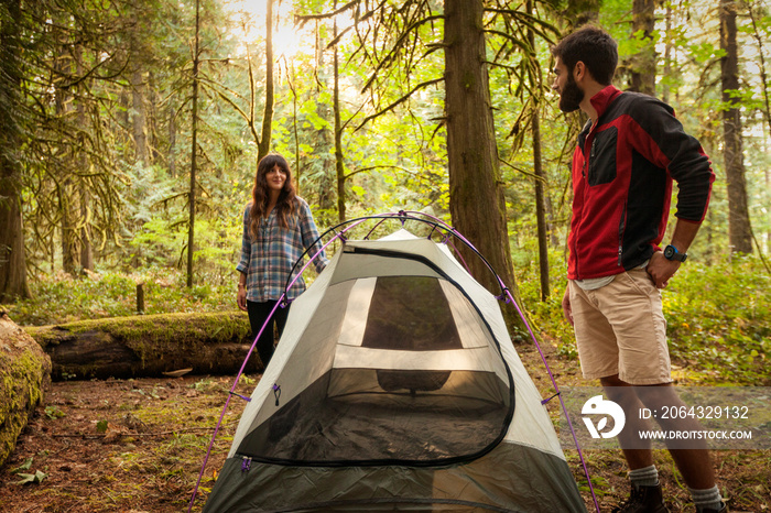 Young couple talking in forest