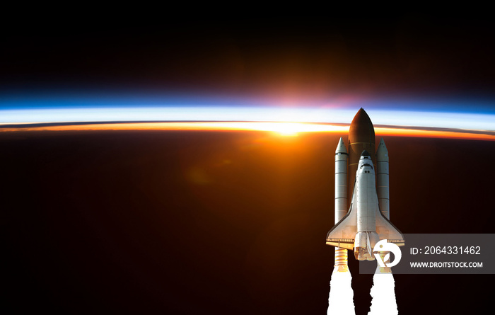 Space Shuttle takes off into space. Elements of this image furnished by NASA.