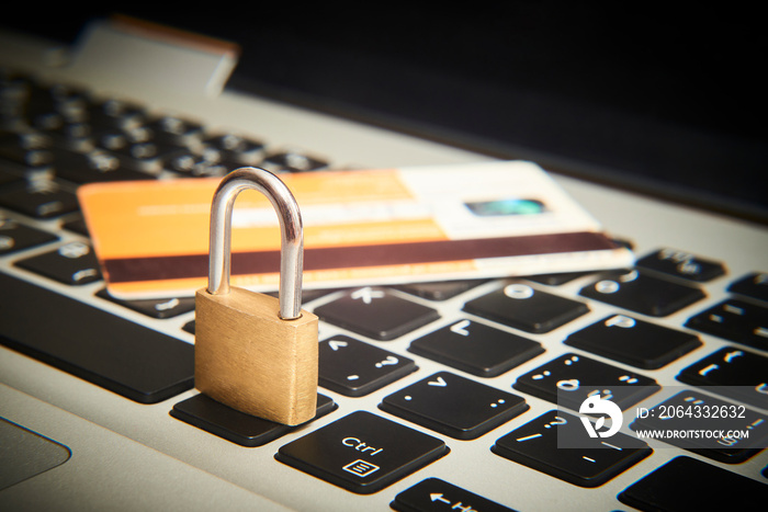 Padlock and credit cards on  computer keyboard. E-commerce data, eshopping and ebanking protection, 