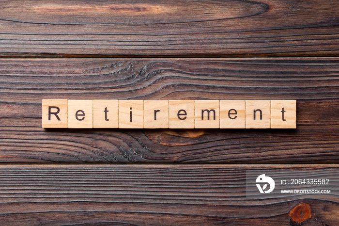 retirement word written on wood block. retirement text on cement table for your desing, concept