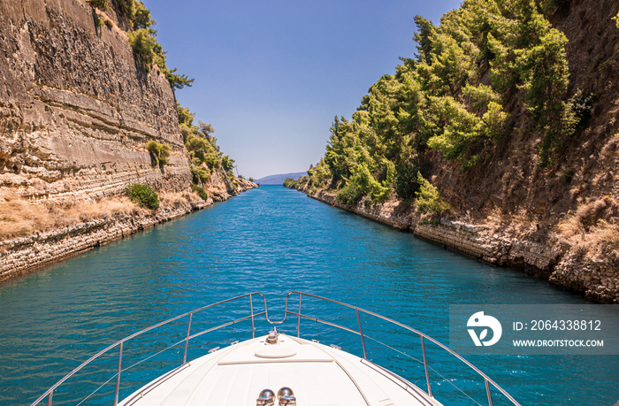 Passing through the Corinth Canal by yacht, Greece. The Corinth Canal connects the Gulf of Corinth w