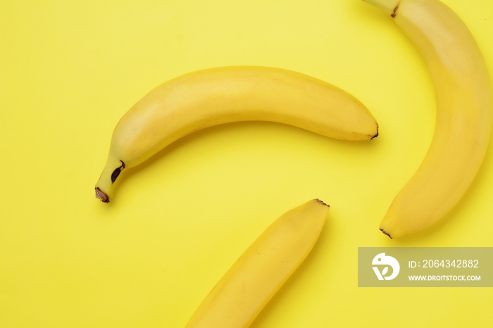 Bunch of bananas on yellow background