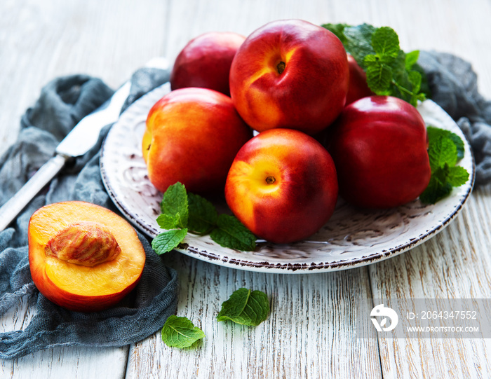 Plate with fresh nectarines