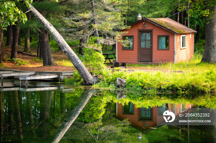 Summer home cabin in the woods at the lake