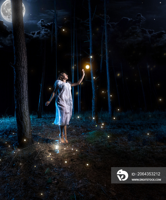 young woman at night forest with full moon jumping high to reach