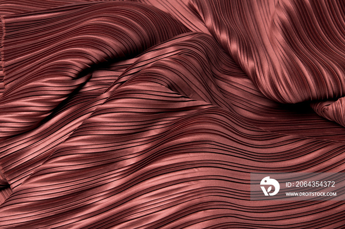 Pleat Fabric in long line drape with shadow, pleated style of textile pattern in red burgundy color 