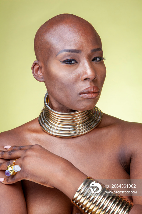 Studio portrait of woman wearing necking necklace and bracelets