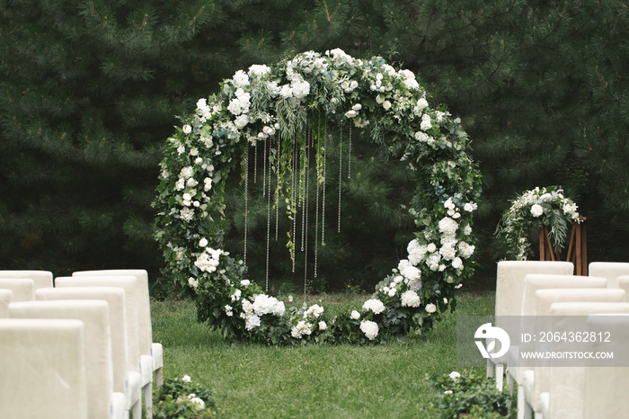 circle wedding arch with flower petals and candles