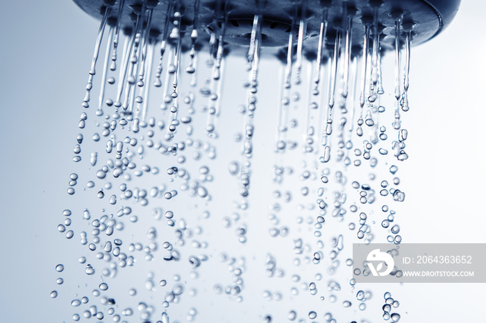 Falling water drops from shower head.