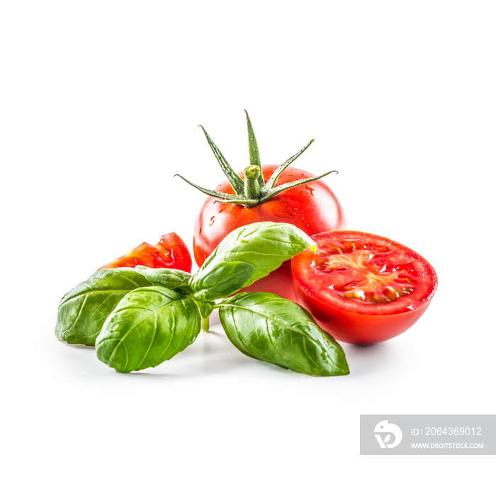 Close-up fresh tomato with basil isolated on fhite background