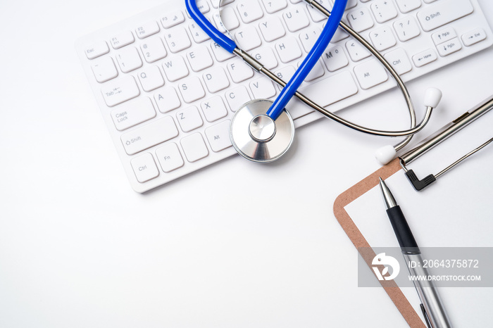 Medical Concept - Stethoscope on computer keyboard on white background. Physician long term care tre