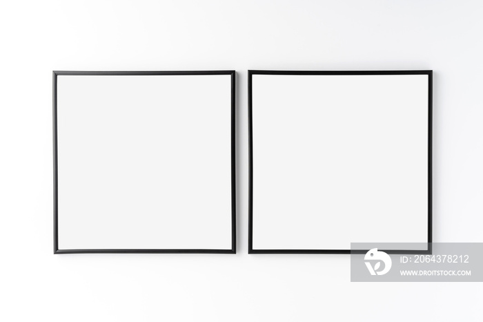 白色背景上两个空相框的实物模型。家居装饰