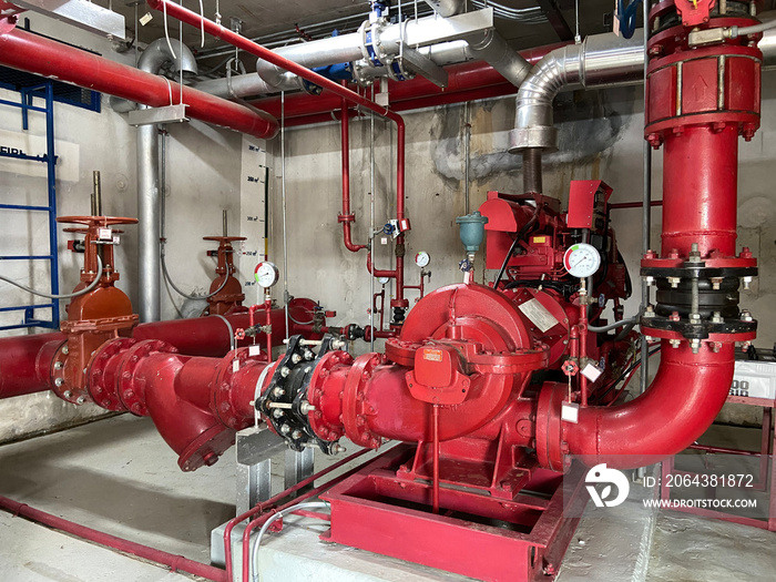 Pump rooms, pipes and valves in large industrial pumping stations