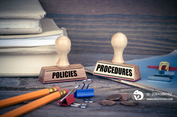 Policies and Procedures concept. Rubber Stamp on desk in the Office. Business and work background.