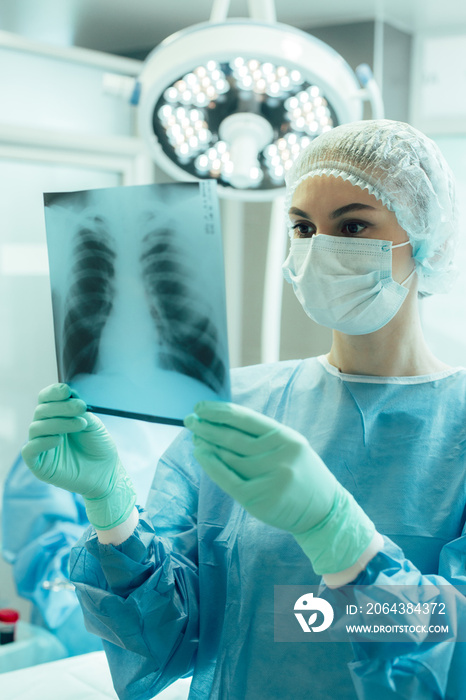 Doctor looking at the x ray of chest stock photo