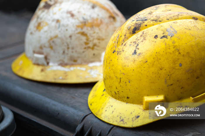 Dirty safety hardhat which is used in the oil field or drilling operation, its got dirty from crude