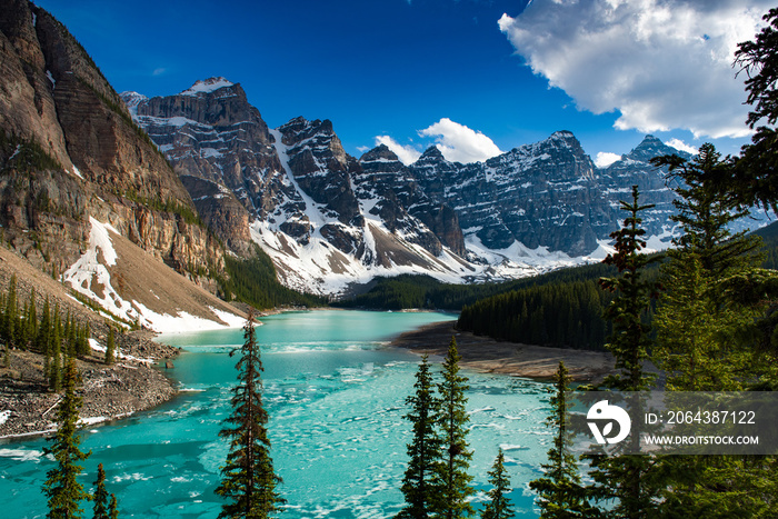 Turquoise water of Moraine Lake near sunset