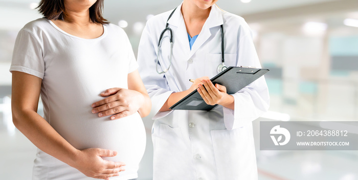 Happy pregnant woman visit gynecologist doctor at hospital or medical clinic for pregnancy consultan