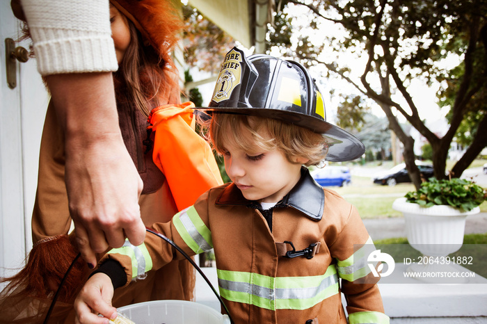 Children collecting sweets on Halloween