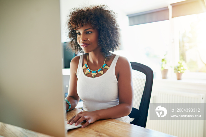 Young African American woman working at a computer